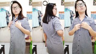 Schoolgirl Cecilia stripping off her button dress